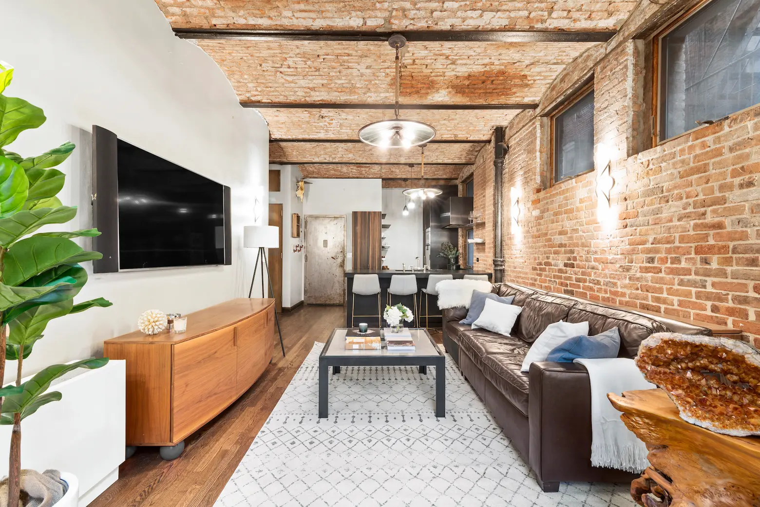 Asking $995K, this rustic West Village co-op has soaring brick barrel-vaulted ceilings