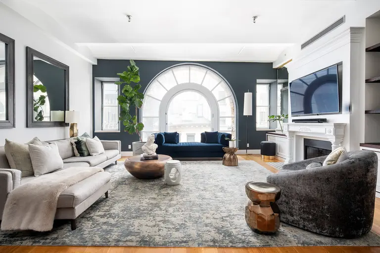 $3.2M FiDi loft stands out behind a historic Palladian window