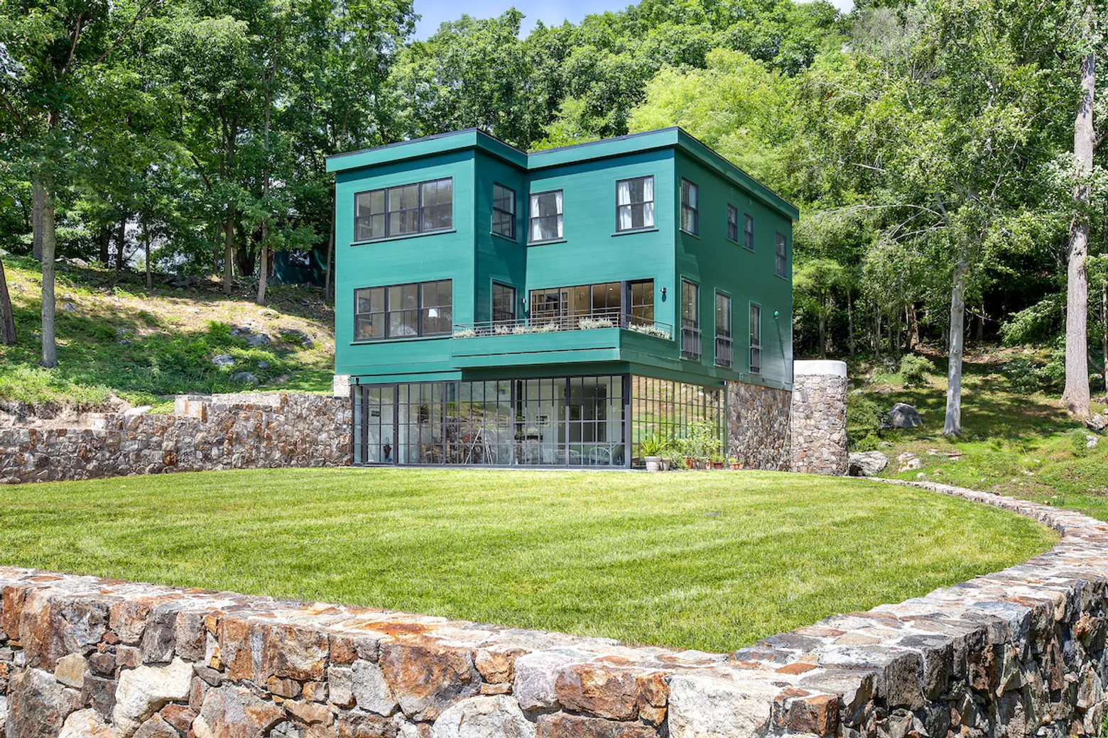 This $8M modern home on the Hudson comes with a Greek Temple playhouse