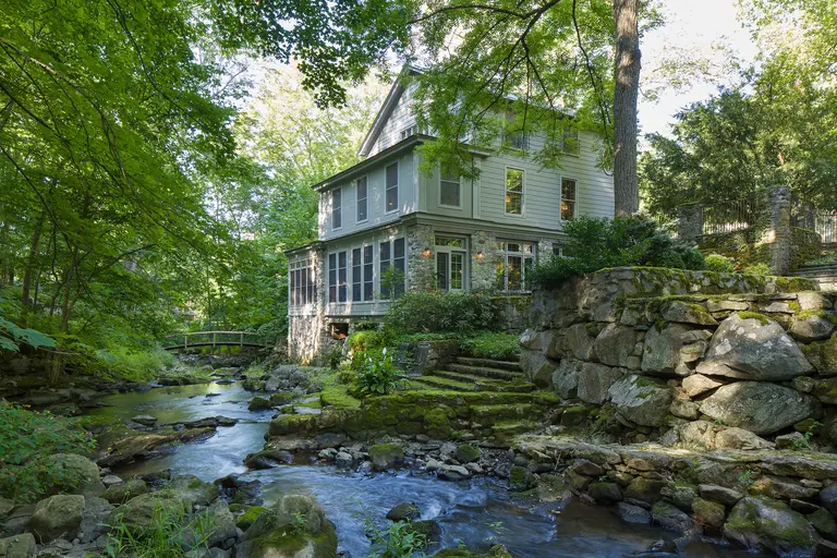 For $2.8M, this 1840s upstate millhouse has a private waterfall, terraced gardens, and a gorgeous pool