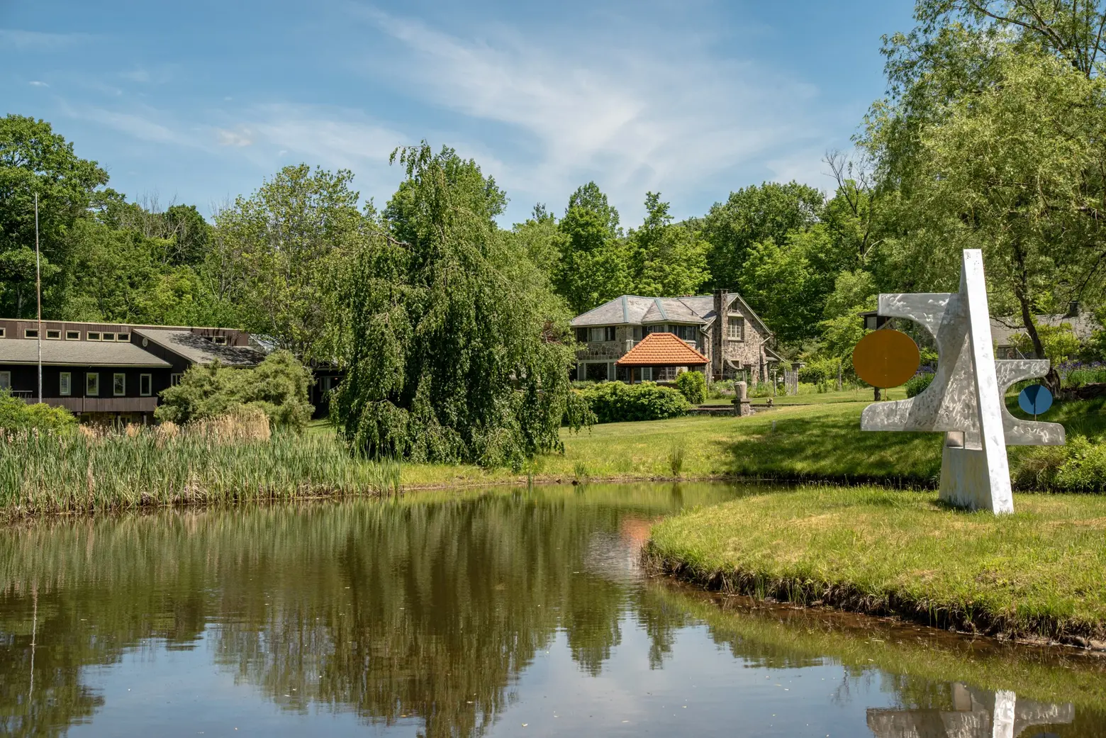 For $2.5M, this Woodstock estate comes with three stone homes, a koi pond, a treehouse, and more