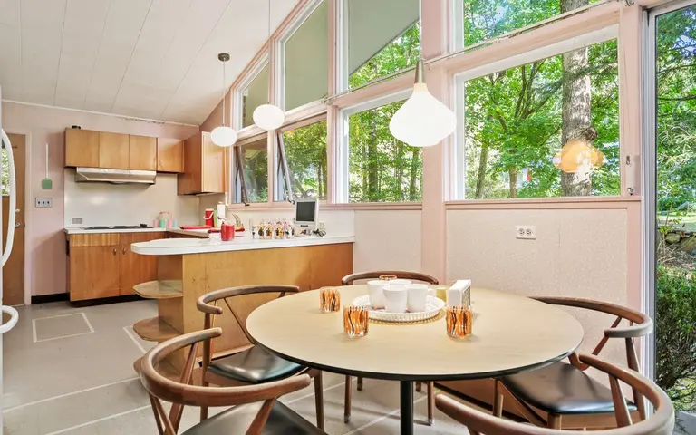 For $1.1M, a mid-century time capsule in Connecticut with pink accents and a retro bar