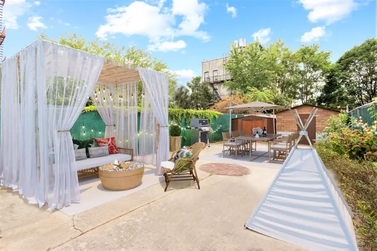The backyard at this $1.1M two-family in Crown Heights is like a Floridian escape