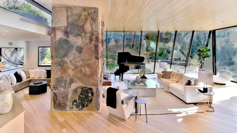 On Long Island, a striking stone and glass home by modernist architect Norman Jaffe asks $3.6M