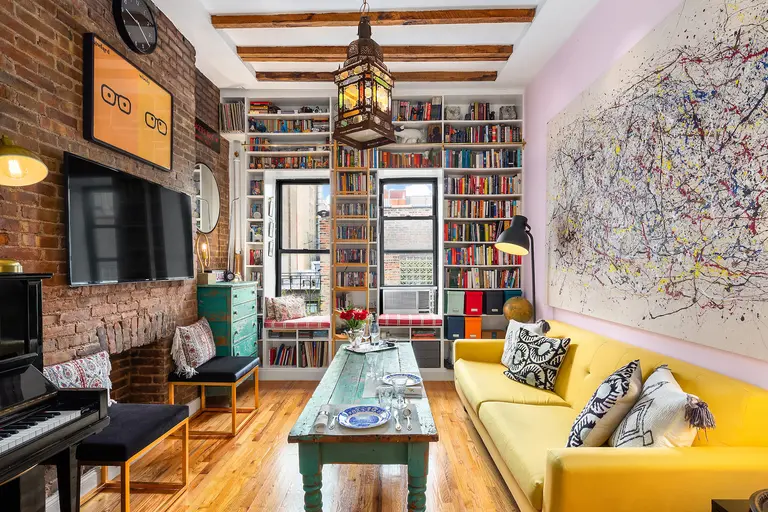 A rolling library ladder is just one fun addition at this $550K Upper East Side one-bedroom