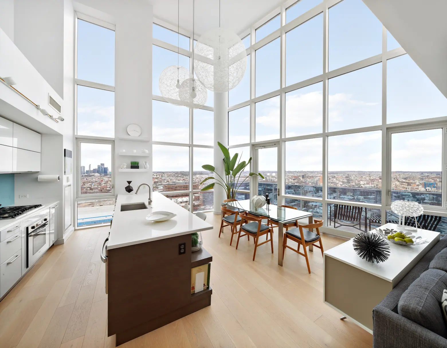 On the Williamsburg waterfront, this $4M penthouse has panoramic views and a private roof deck