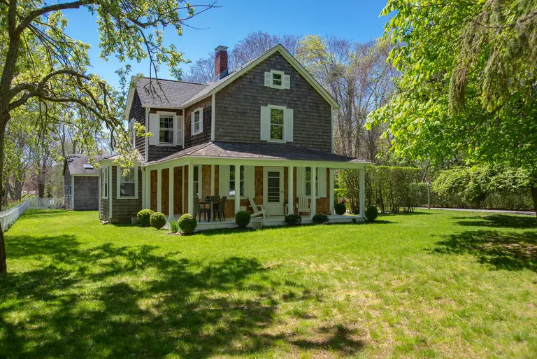 With a guest house, pool, and golf course views, this $2.2M Hamptons farmhouse is summer ready