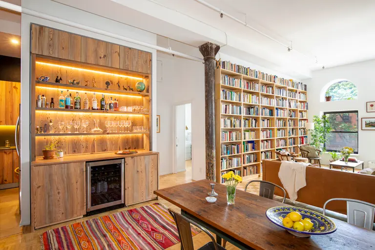 Floor-to-ceiling bookshelves and a beautiful bar stand out at this $995K Boerum Hill co-op