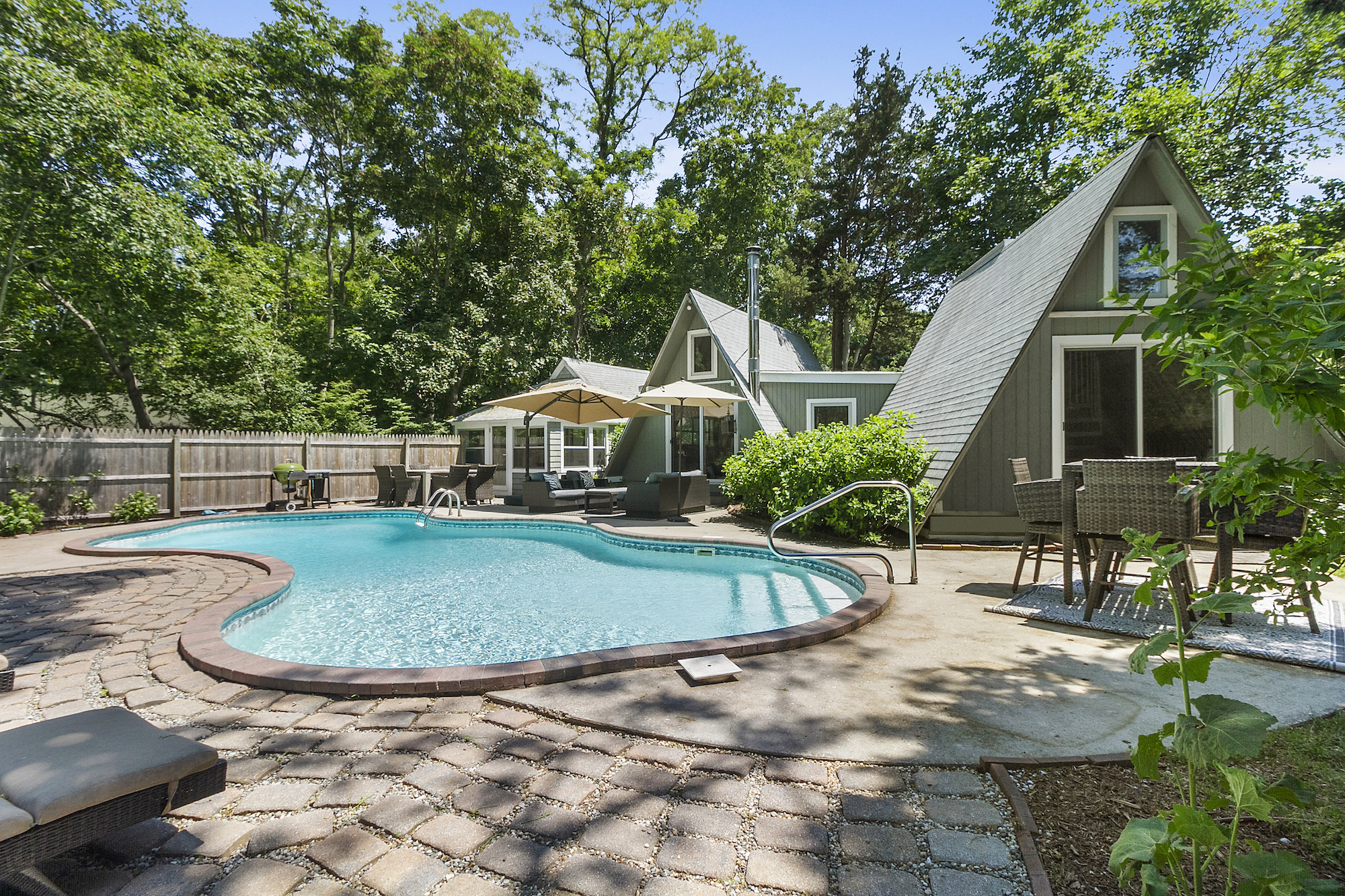 $1.8M Hamptons home is relaxation-ready with crisp interiors and a serene  backyard