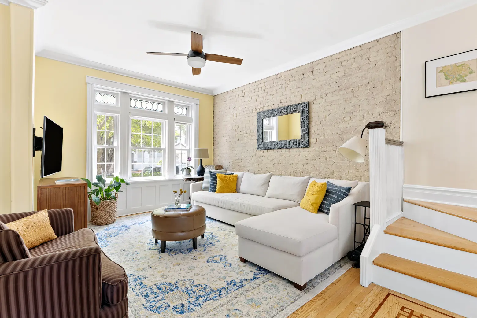 For $1.25M, an attached house in Bay Ridge with sunny interiors and a lush backyard