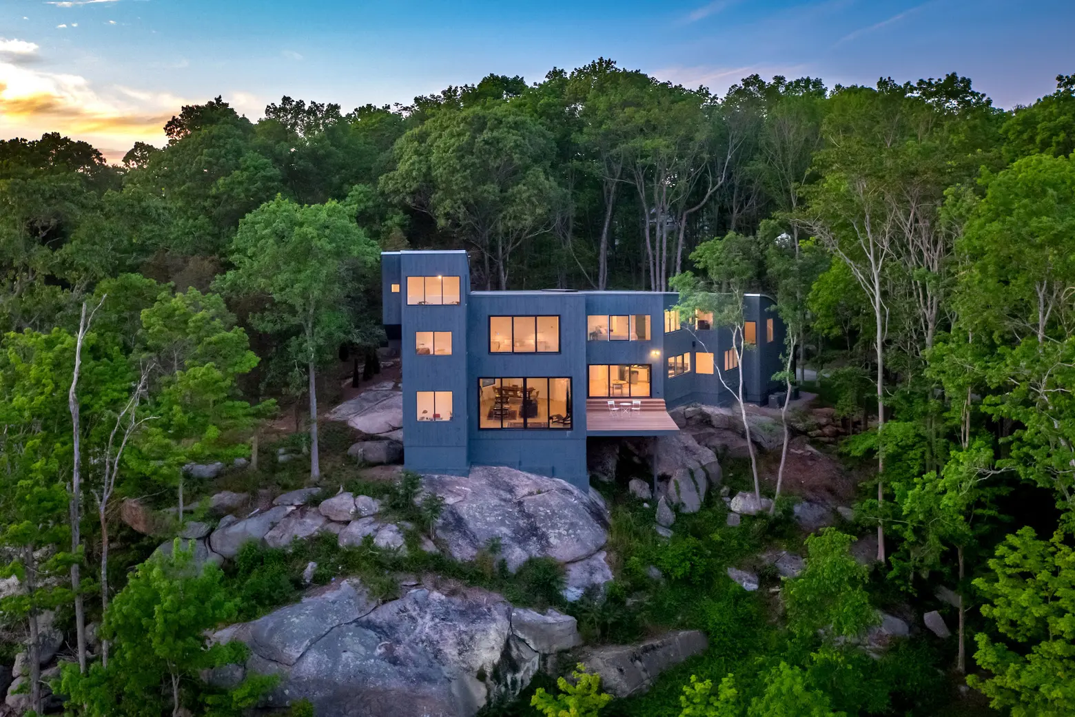 $2.8M contemporary Connecticut home sits on a granite outcropping overlooking the saltmarsh below
