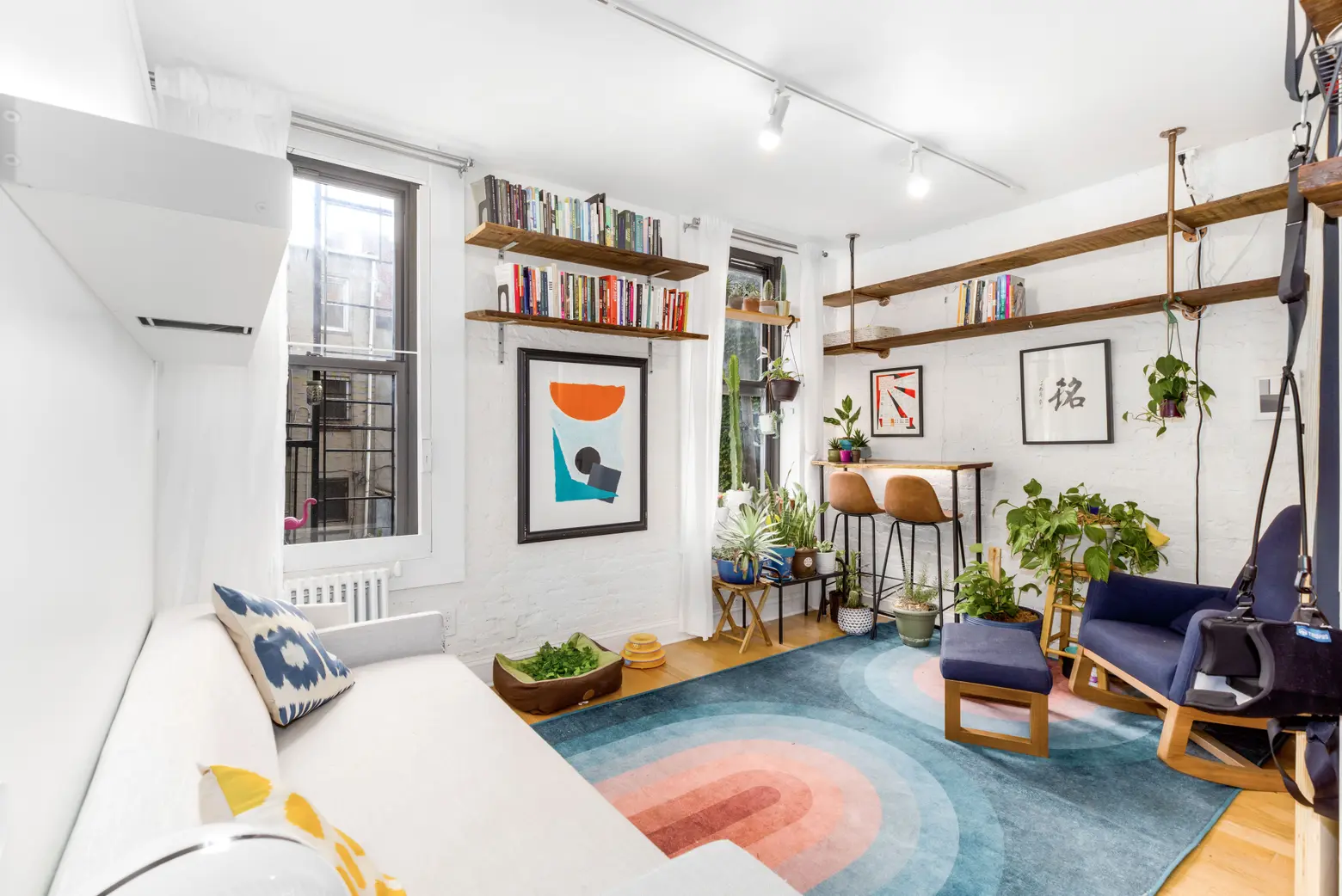 Plants and pops of color make this $369K Williamsburg one-bedroom a happy home
