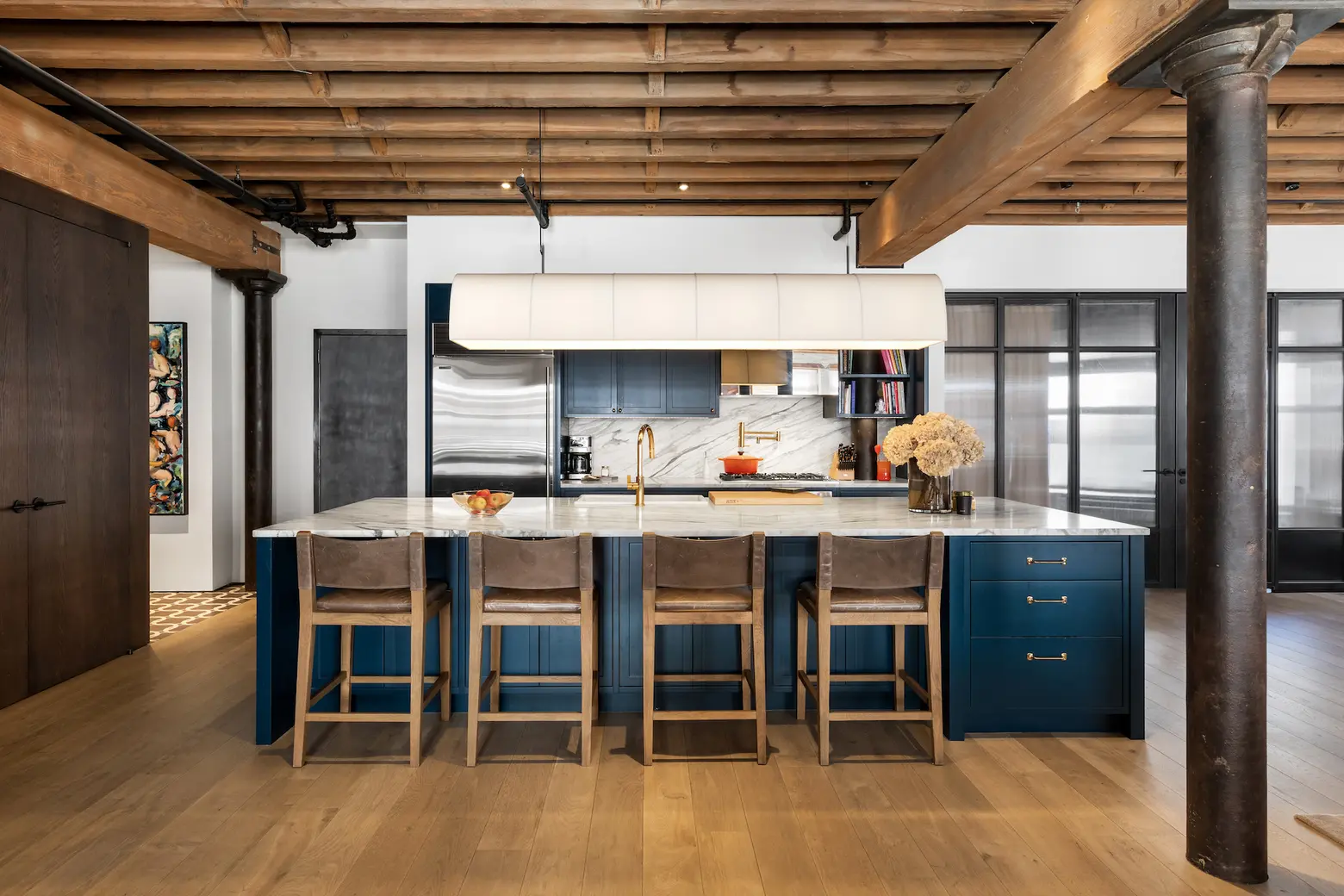 All Hail This Tribeca Family Loft With Dramatic Brick And Elegant  Industrial Details kitchen with textured ceiling, white back splash and  island - Luxe Interiors + Design