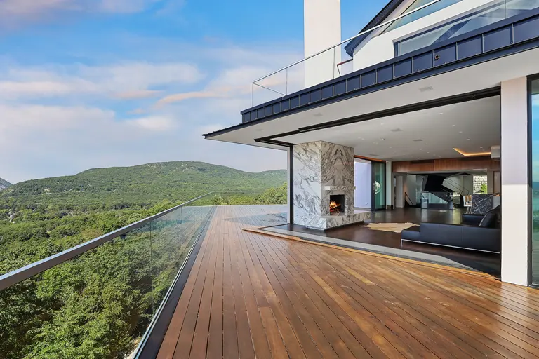 Enjoy Hudson River views from a cantilevered terrace above the tree line in this $6.3M upstate home