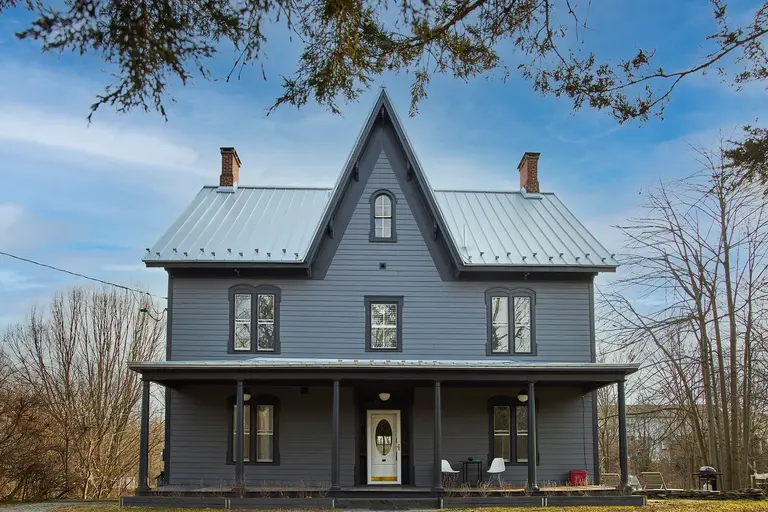 For $850K, this artist-renovated upstate Gothic farmhouse has a basement apartment and a barn