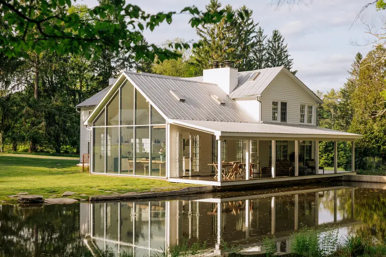 This $2.87M upstate ‘floating farmhouse’ is an 1800s home with walls of glass, overlooking a waterfall