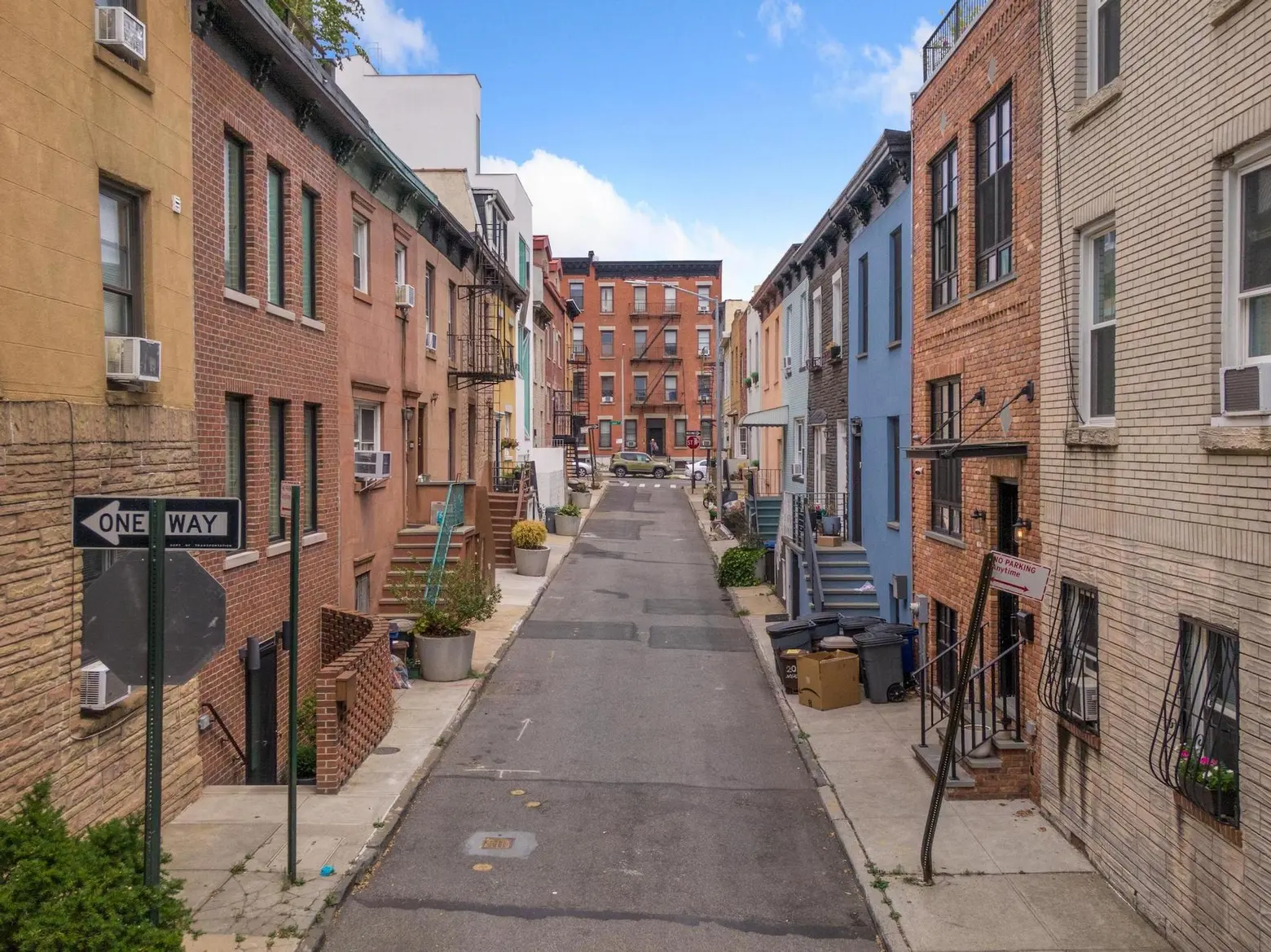 Asking $3.2M, a rare pair of townhouses on Brooklyn’s quaint ‘secret’ block with tiny doors