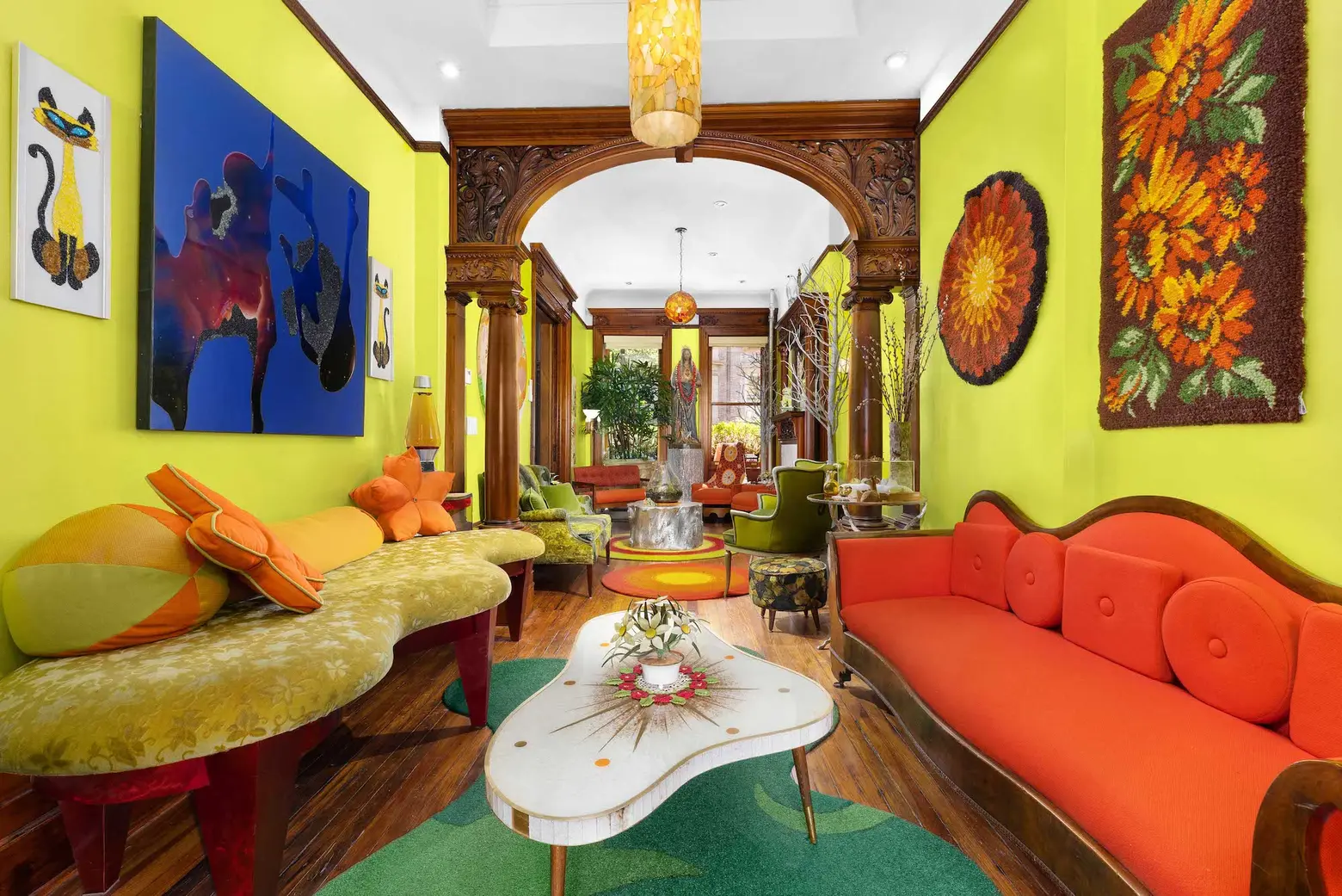 Vibrant colors & a creative vibe complement historic details in this $3.9M Hamilton Heights townhouse