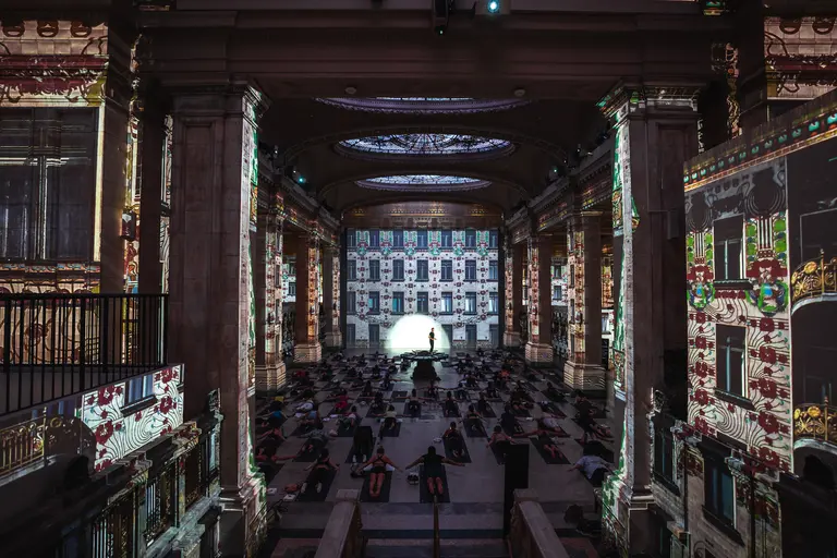 Take a yoga class surrounded by immersive art in NYC’s Hall des Lumières