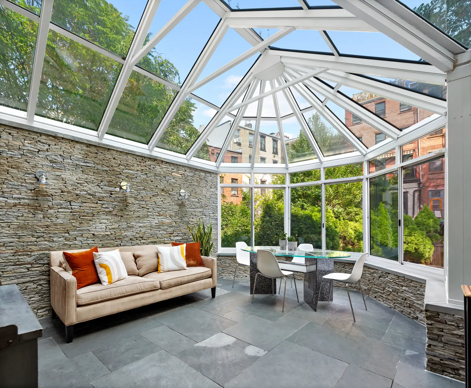 Gaze at your fairytale garden from the glass atrium in this $6.1M Fort Greene brownstone