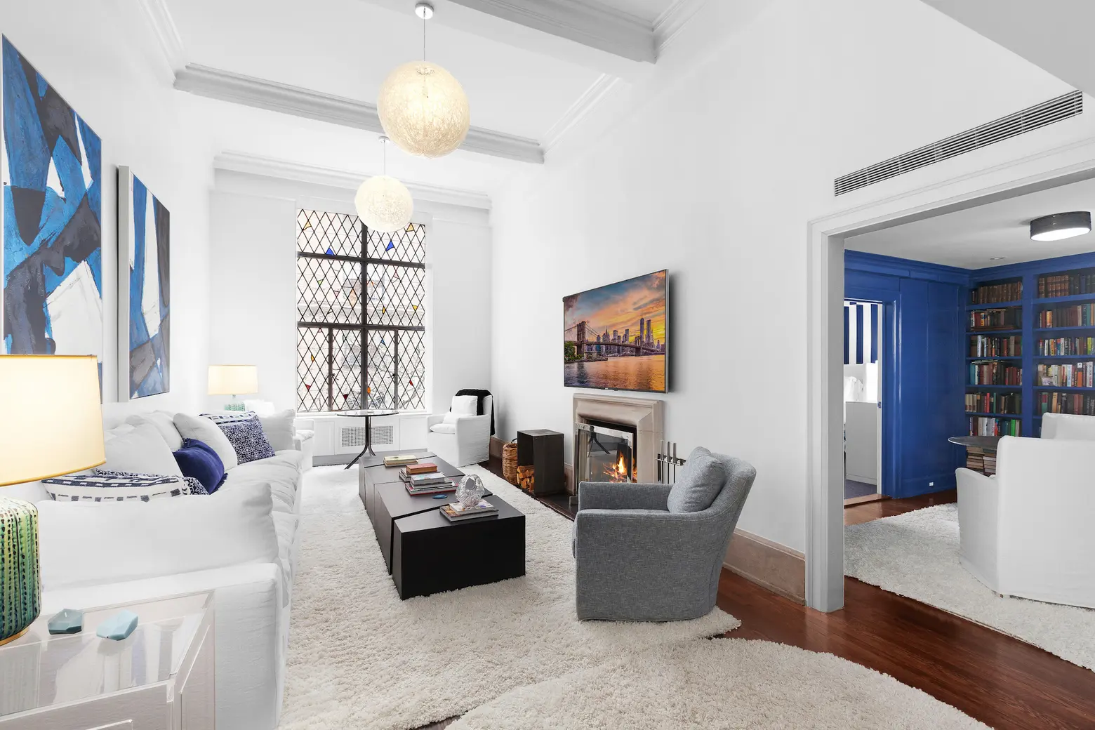 This $1.3M Upper East Side co-op has a secret powder room tucked behind a library wall