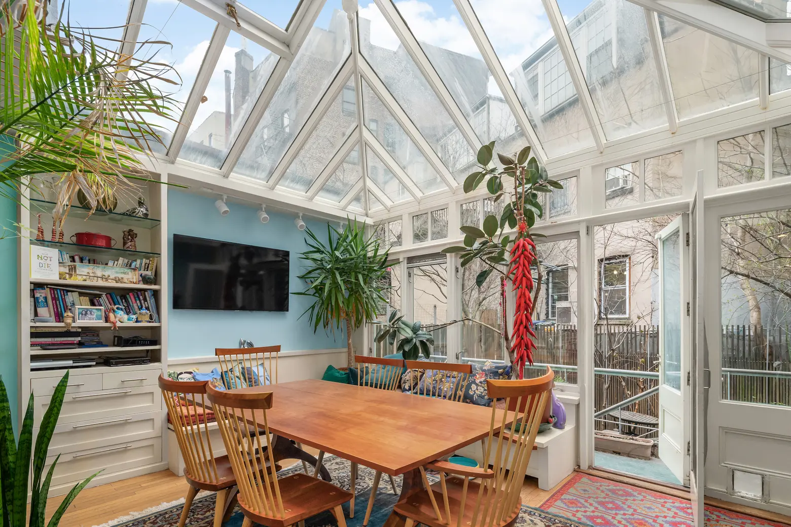 Dine and stargaze from a glass atrium in this historic $7.75M Village townhouse