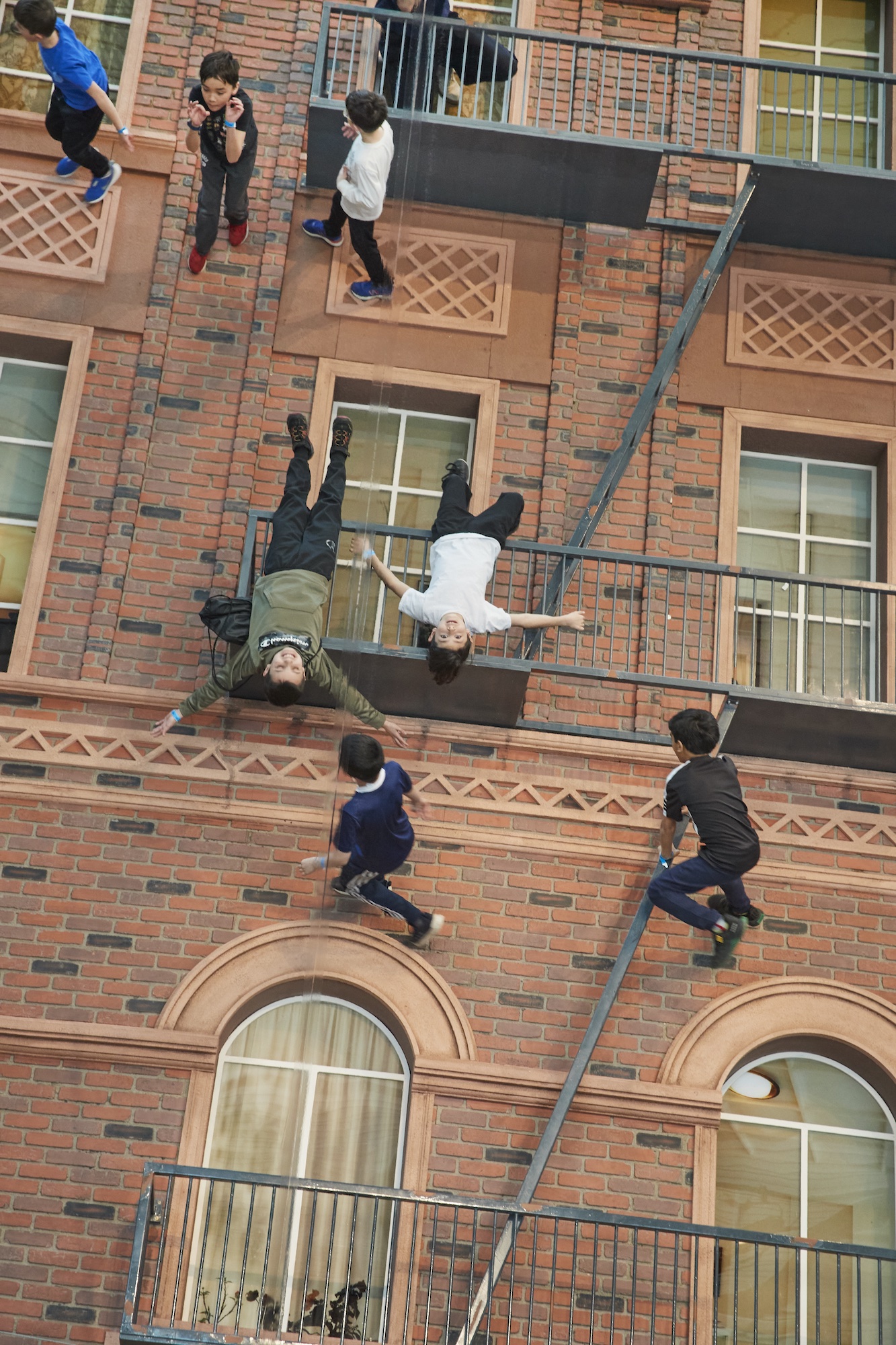 This art installation makes it look like visitors are climbing a