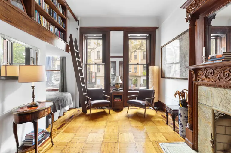 Cozy up by the fireplace in this $559K Upper West Side brownstone studio