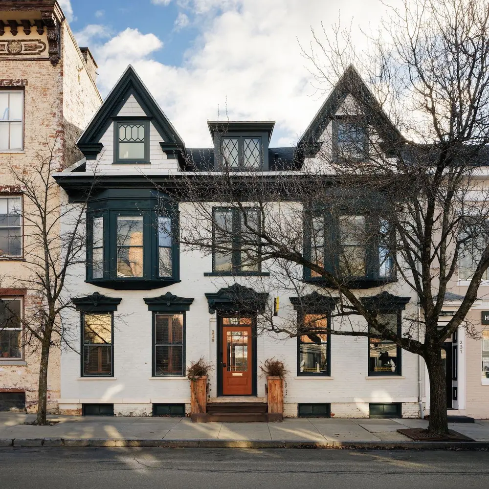 19th-century townhouse in Hudson, NY has three units, retail space, and a three-bay garage for $2M