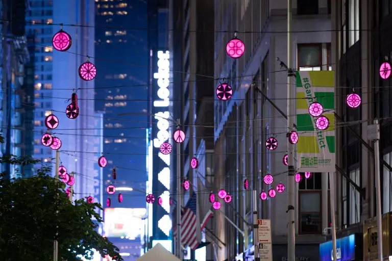 Colorful lanterns sparkle over Broadway in the Garment District