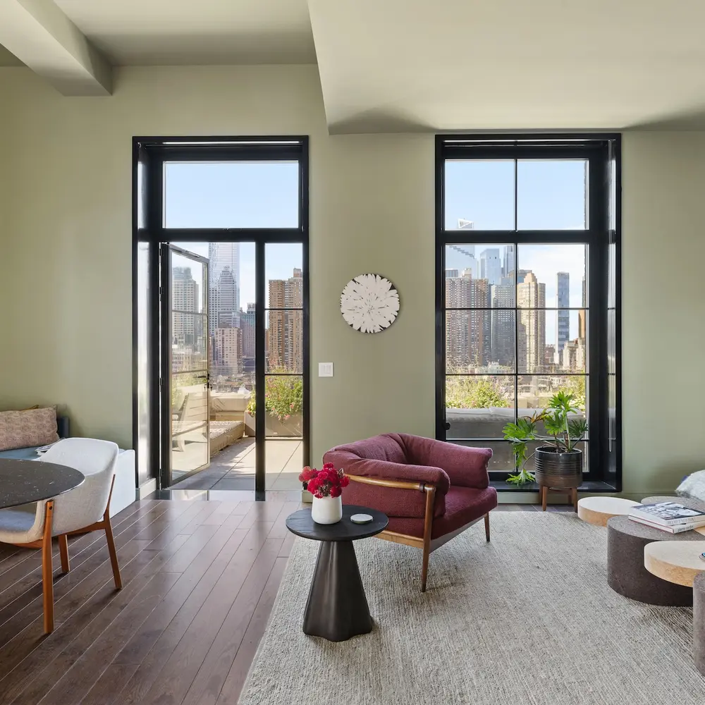 The corner terrace at this $4.4M Stella Tower condo puts the city skyline at your feet