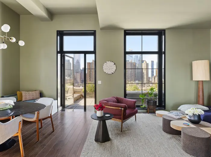 The corner terrace at this $4.4M Stella Tower condo puts the city skyline at your feet