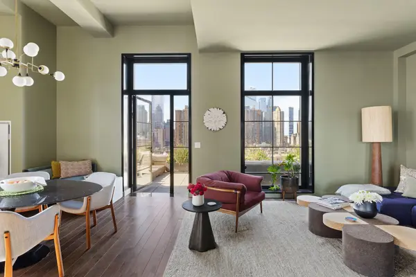 The corner terrace at this $4.4M Stella Tower condo puts the city skyline at your feet