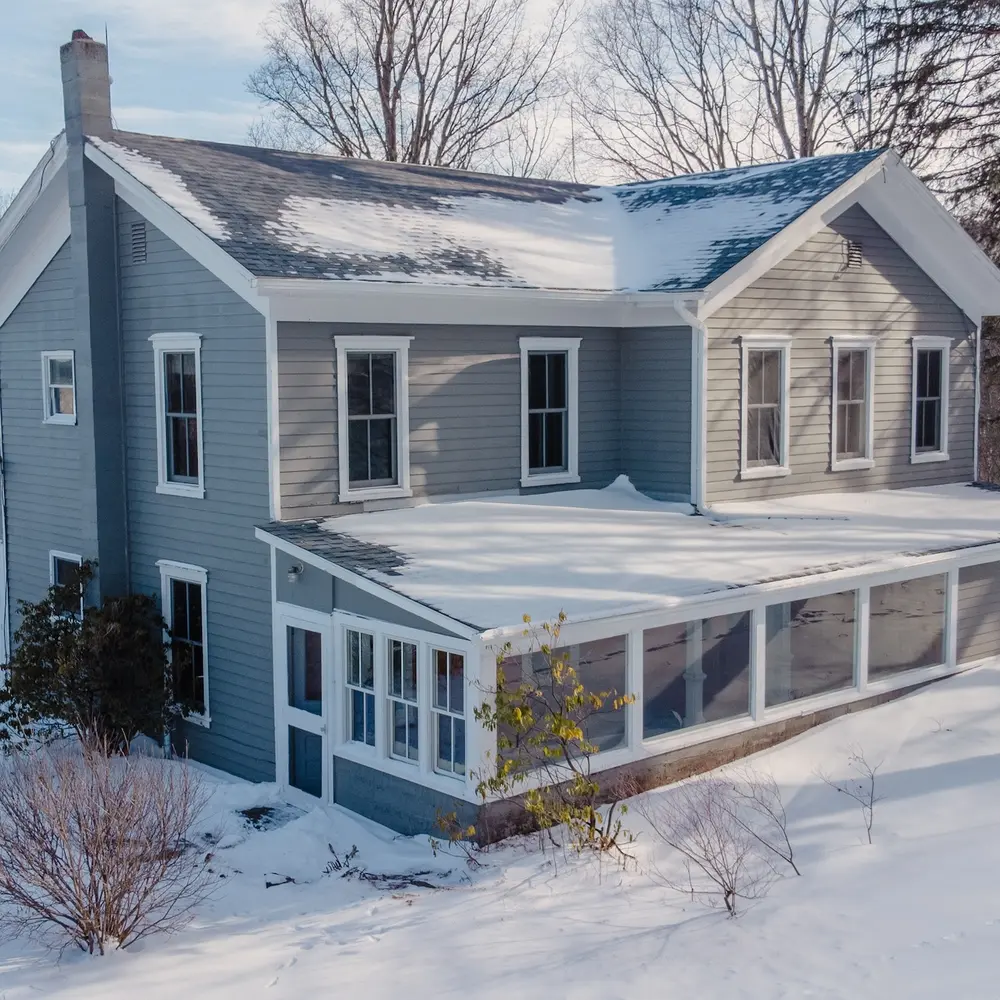 For $549K, get cozy in an 1860s Catskills farmhouse with barns, sun porches, and a dreamy country kitchen