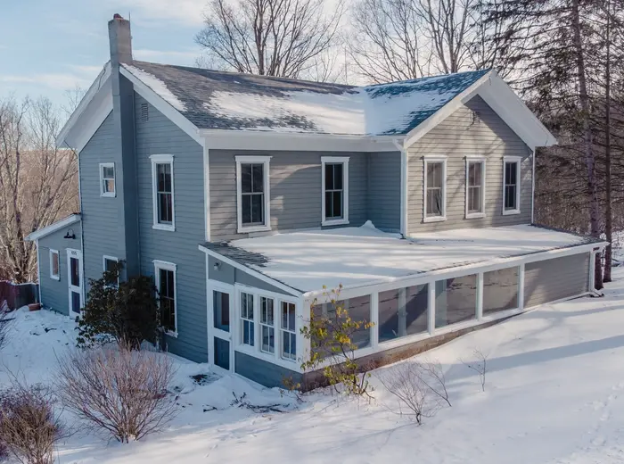 For $549K, get cozy in an 1860s Catskills farmhouse with barns, sun porches, and a dreamy country kitchen