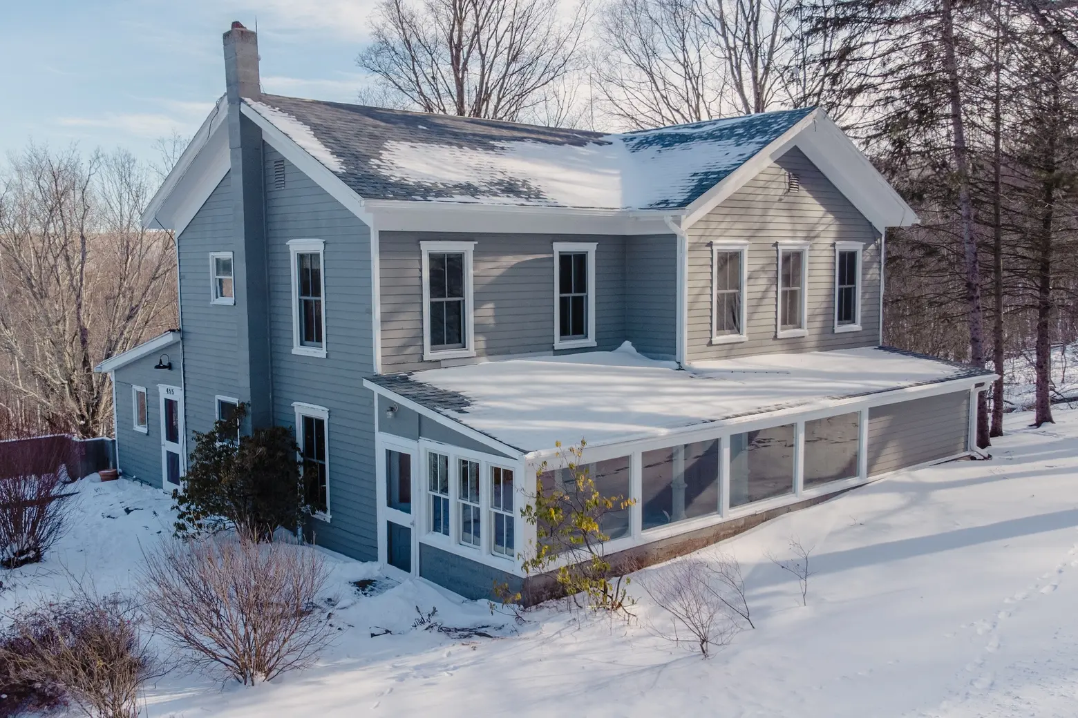 For $549K, get cozy in an 1860s Catskills farmhouse with barns, sun porches, and a dreamy country kitchen