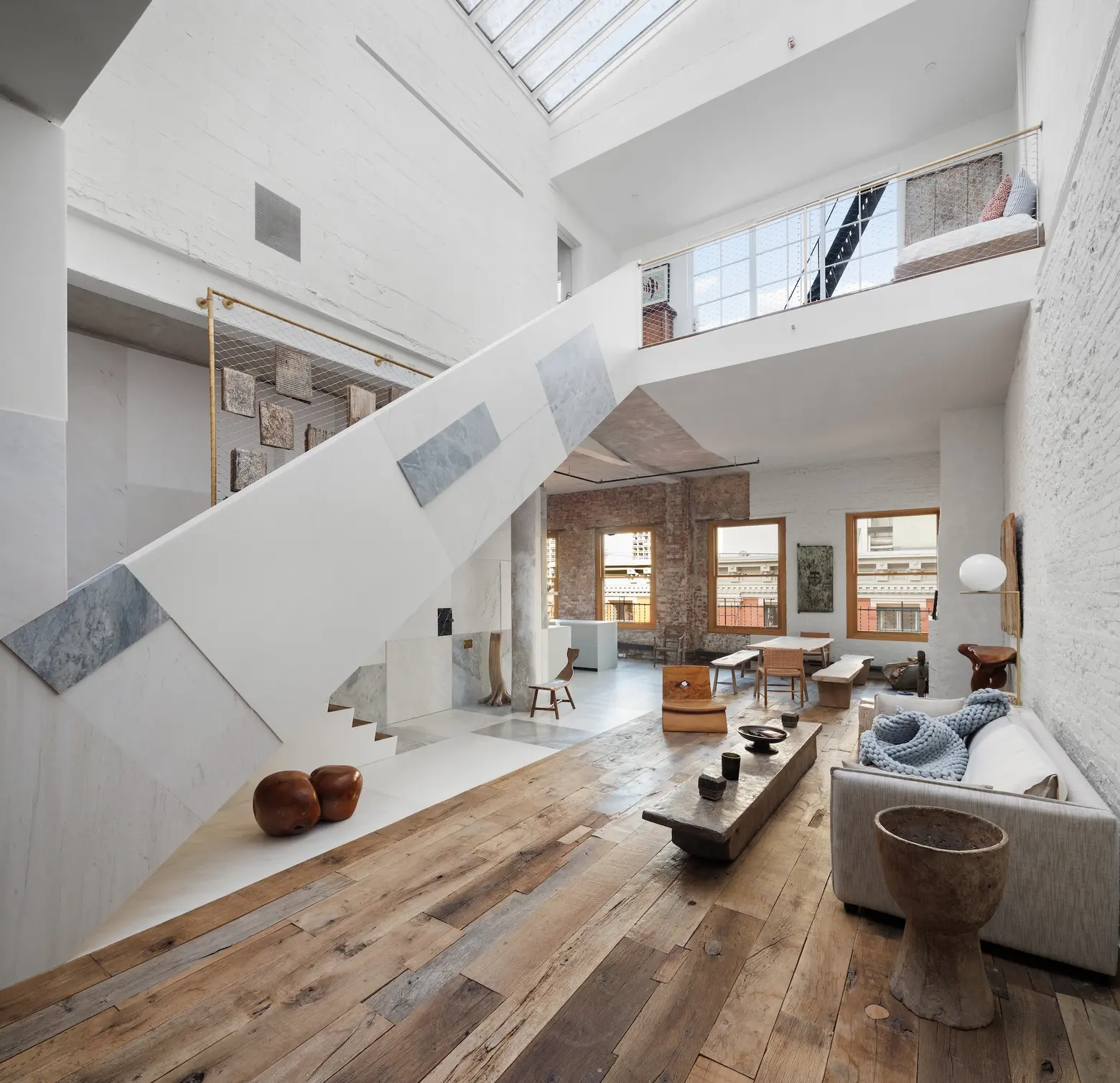 Marble slabs and hand-painted terraces make for an unconventional Soho penthouse, listed for $8M